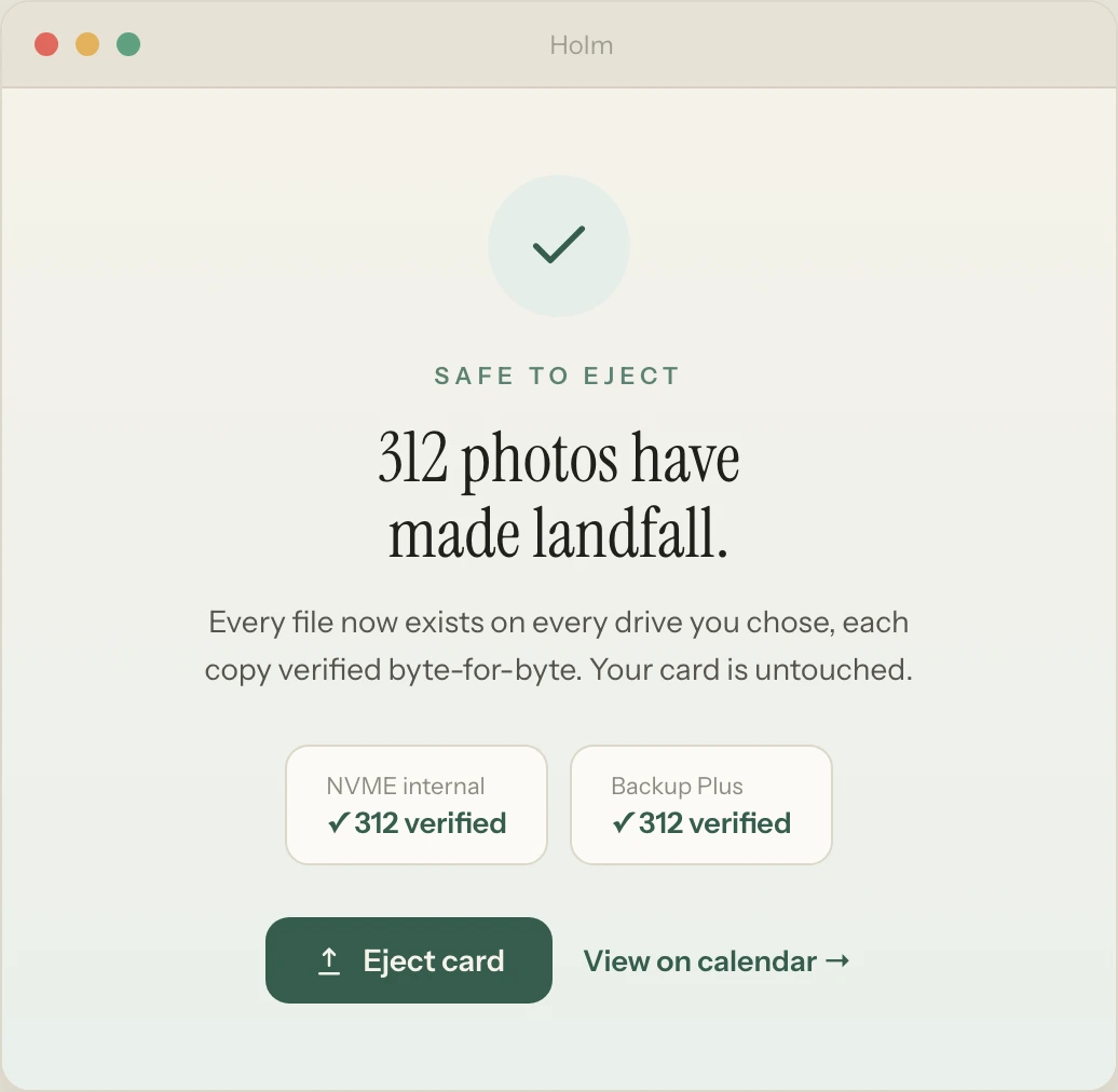 Holm showing 312 photos safely backed up and verified on two drives — safe to eject the card.